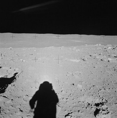 AS 14-64-9098 - Rocks, boulders and a distant LM
Original caption:"Al takes an excellent pan at Station C-Prime, starting with this down-Sun. The LM is at the left, just above the center line. Al and Ed are in the midst of a field of small boulders. 
As we now know, they are about 75 mt South-East of the Southern Rim of Cone Crater. 
Note the split boulder at the right edge of the photograph".
Parole chiave: Lunar Panorama