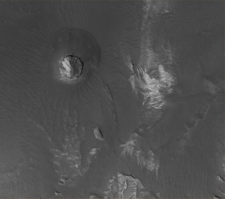 Features of Eos Chaos: Circular Butte (Original NASA/MGS/MSSS b/w Frame - 1)
Original caption:"This MGS-MOC image shows light-toned, Layered Rock Outcrops in Eos Chaos, located near the East end of the Valles Marineris Trough System. The Outcrops occur in the form of a distinct, circular Butte (image 1) and a high Slope (image 2). The rocks might be sedimentary rocks, similar to those found elsewhere exposed in the Valles Marineris System and the Chaotic Terrain to the East of the Region".

Location near: 12,9° South Lat. and 49,5° West Long.  
Image width: ~3 Km (~1,9 mi)  
Illumination from: lower left  
Season: Southern Summer
Parole chiave: Mars from orbit - Eos Chasma