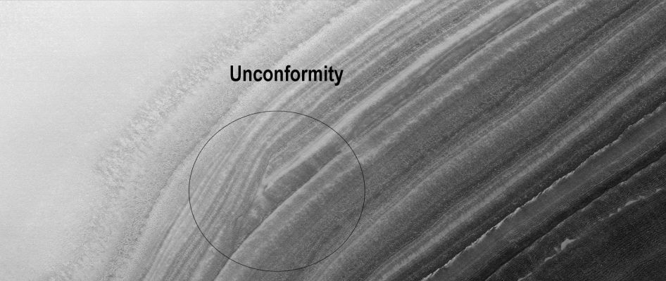 North Polar "Unconformity" (Original NASA/MGS/MSSS b/w Frame)
Caption NASA originale:"This MGS-MOC image shows layered material exposed on a slope in the North Polar Region. 
An "unconformity" is visible in the middle/lower left of the image, where layers are abruptly truncated. Unconformities are indicators of drastic change in the Region — the lower layers were deposited first, then eroded, then the upper layers were deposited".

Location near: 81,1° North Lat. and 75,2° West Long.
Image width: ~3 Km (~1,9 mi)  
Illumination from: lower left  
Season: Northern Spring
Parole chiave: Mars from orbit - North Polar Features - Unconform Layers