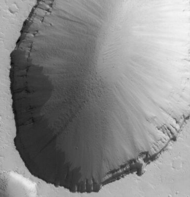 Collapse Pit in Tractus Fossae (Original NASA/MGS/MSSS b/w Frame)
Original Caption:"This MGS-MOC image shows a 1,5 meters (5 feet) per pixel view of a large Collapse Pit in the Tractus Fossae portion of the Tharsis Region of Mars. Such collapses usually occur along faults formed by expansion and pulling apart of the Planet's Upper Crust". 

Location near: 22,5° North Lat. and 101,4° West Long.
Image width: width: ~3 Km (~1,9 mi) 
Illumination from: lower left 
Season: Northern Autumn
Parole chiave: Mars from orbit - Volcanic Features - Collapse Pit