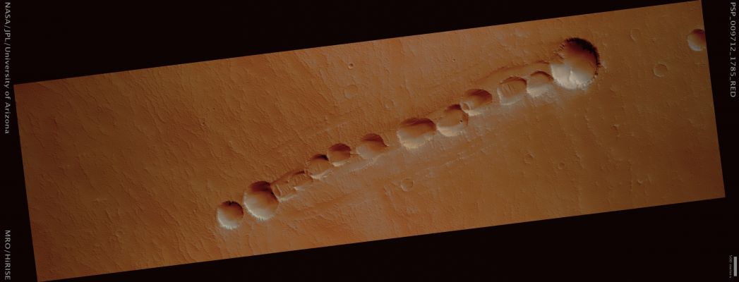 Pit-Chain in South-Western Pavonis Mons (possible True Colors; credits: Lunar Explorer Italia)
Mars Local Time: 15:30 (middle afternoon)
Coord. (centered): 1,4° South Lat. and 245,1° East Long.
Spacecraft altitude: 254,6 Km (such as about 159,1 miles) 
Original image scale range: 50,9 cm/pixel (with 1 x 1 binning) so objects ~1,53 mt across are resolved 
Map projected scale: 50 cm/pixel 
Map projection: EQUIRECTANGULAR 
Emission Angle: 0,5° 
Phase Angle: 56,9°
Solar Incidence Angle: 56° (meaning that the Sun is about 34° above the Local Horizon)
Solar Longitude: 116,2° (Northern Summer)
Credits: NASA/JPL/University of Arizona
Additional process. and coloring: Lunar Explorer Italia
Parole chiave: Mars from orbit - Volcanic Regions - South-West of pavonis Mons